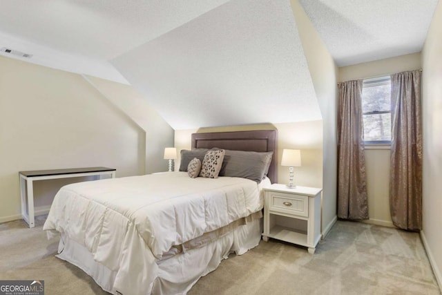 836 Palmetto Tyrone Rd, Sharpsburg, GA 30277 - bedroom with light colored carpet, lofted ceiling, baseboards, and a textured ceiling