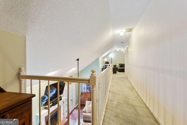 836 Palmetto Tyrone Rd, Sharpsburg, GA 30277 - hallway featuring light carpet, lofted ceiling, and an upstairs landing