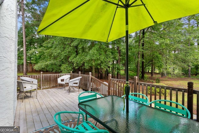 836 Palmetto Tyrone Rd, Sharpsburg, GA 30277 - deck with outdoor dining area and view of scattered trees