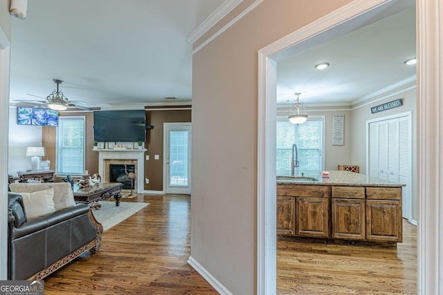 5342 Lakerock Dr SW, South Fulton, GA 30331 - hallway with a sink, wood finished floors, ornamental molding, and baseboards