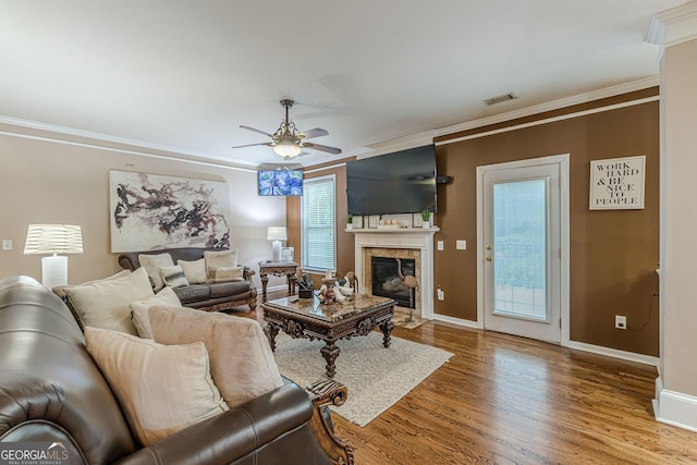 5342 Lakerock Dr SW, South Fulton, GA 30331 - living room with ornamental molding, a ceiling fan, wood finished floors, a tile fireplace, and baseboards