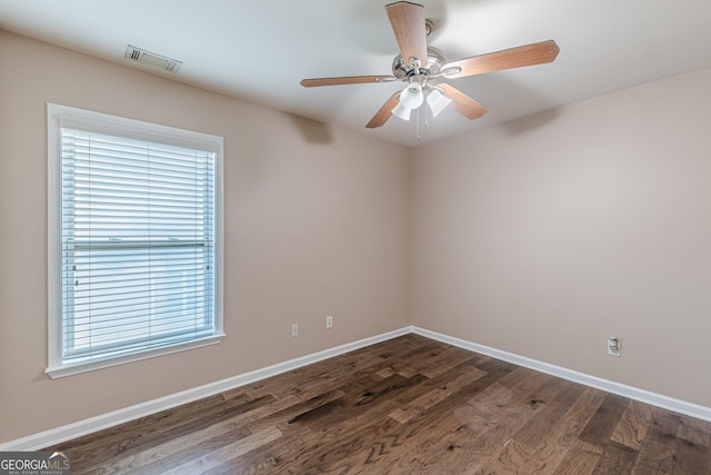 5342 Lakerock Dr SW, South Fulton, GA 30331 - unfurnished room with dark wood finished floors, plenty of natural light, and baseboards