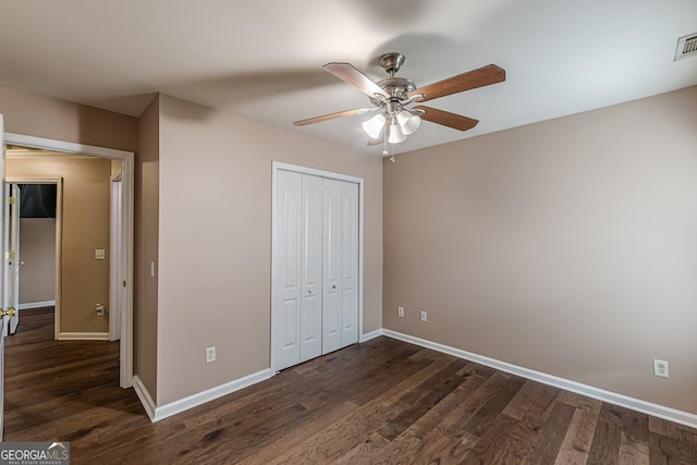 5342 Lakerock Dr SW, South Fulton, GA 30331 - unfurnished bedroom featuring baseboards, a closet, and dark wood-type flooring
