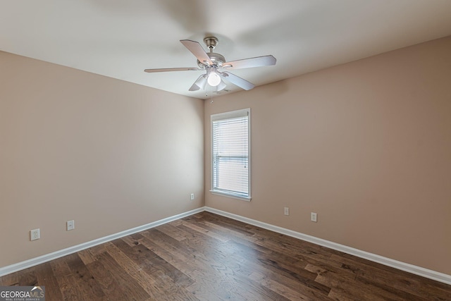 5342 Lakerock Dr SW, South Fulton, GA 30331 - empty room with baseboards, dark wood-style flooring, and a ceiling fan