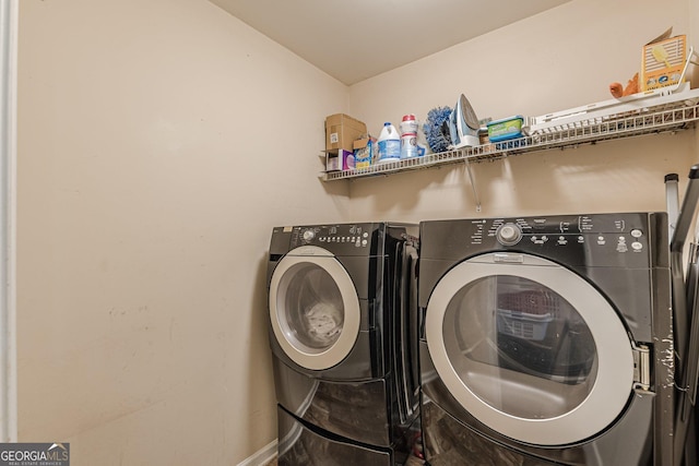 5342 Lakerock Dr SW, South Fulton, GA 30331 - laundry room with independent washer and dryer and baseboards