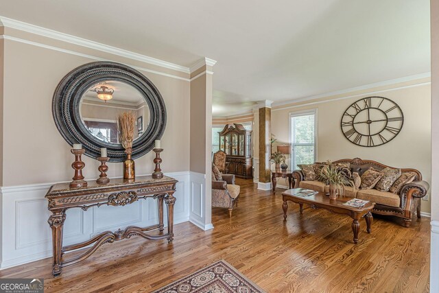 5342 Lakerock Dr SW, South Fulton, GA 30331 - living room with wood finished floors, crown molding, wainscoting, and a decorative wall