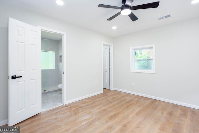 2131 Glendale Dr, Decatur, GA 30032 - unfurnished bedroom with wood finished floors, recessed lighting, baseboards, and connected bathroom