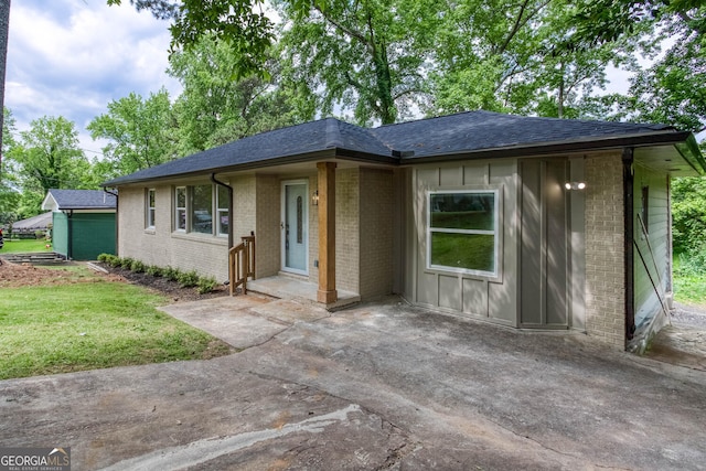 2131 Glendale Dr, Decatur, GA 30032 - ranch-style house with brick siding, a patio, a shingled roof, and a front lawn