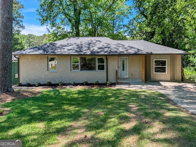 2131 Glendale Dr, Decatur, GA 30032 - ranch-style home featuring brick siding, a front yard, roof with shingles, and board and batten siding
