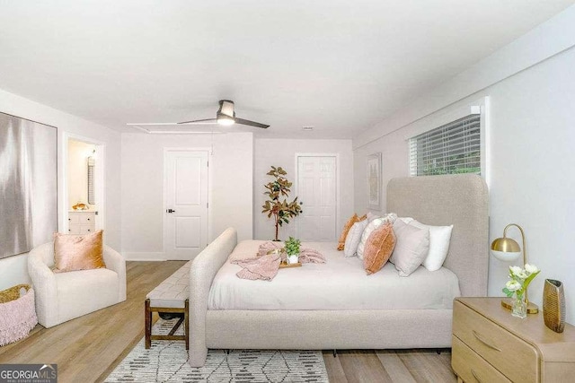 bedroom with wood finished floors and a ceiling fan