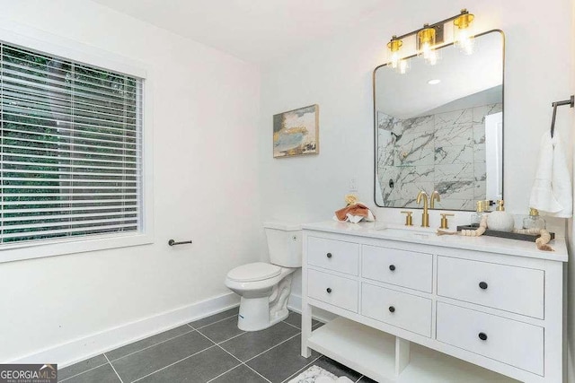 bathroom with tile patterned floors, baseboards, toilet, a shower, and vanity