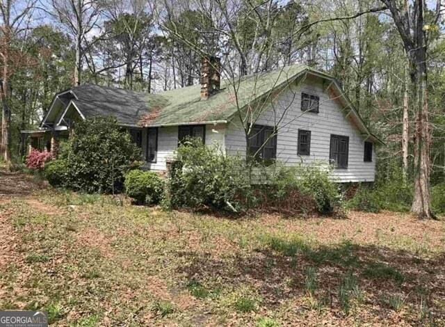 650 Sage St, Temple, GA 30179 - view of front facade with a chimney