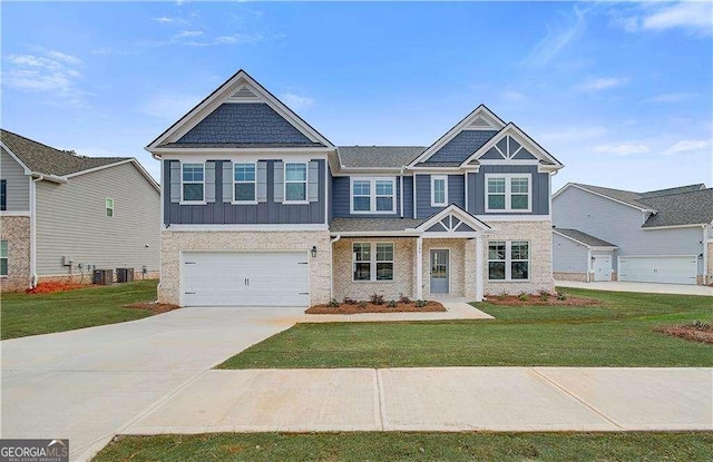 242 Linford Dr, Locust Grove, GA 30248 - craftsman house featuring board and batten siding, concrete driveway, a front yard, and an attached garage