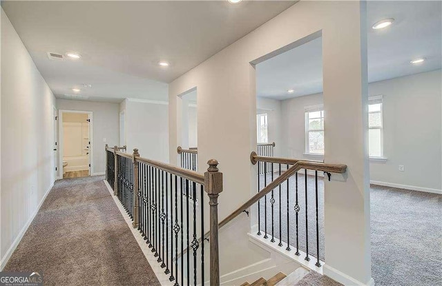 242 Linford Dr, Locust Grove, GA 30248 - hall with carpet floors, an upstairs landing, and recessed lighting