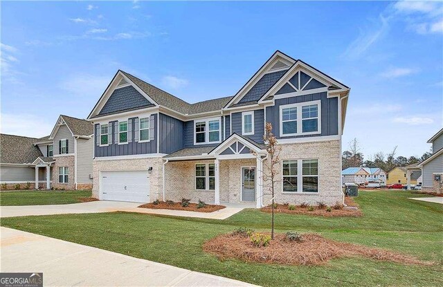 242 Linford Dr, Locust Grove, GA 30248 - view of front of house featuring board and batten siding, a garage, a front yard, and concrete driveway