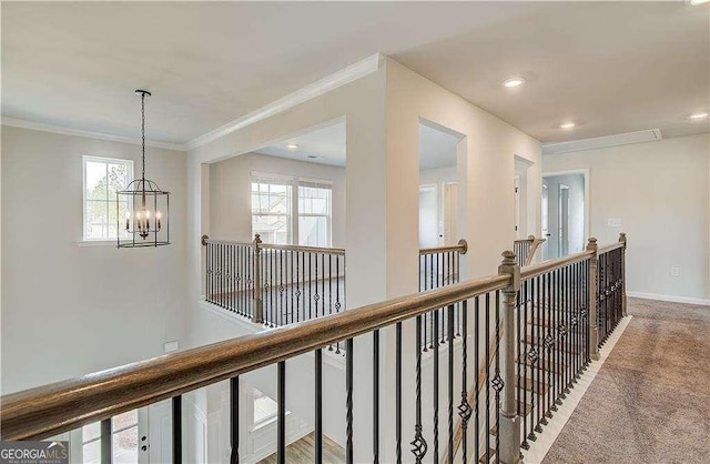 242 Linford Dr, Locust Grove, GA 30248 - corridor featuring an upstairs landing, ornamental molding, a chandelier, carpet flooring, and recessed lighting