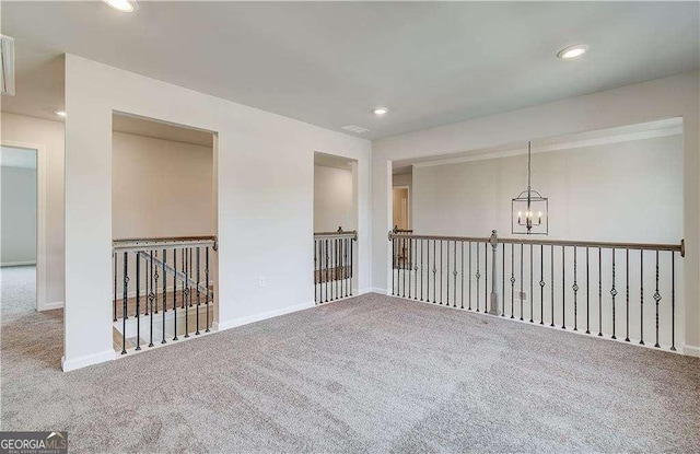 242 Linford Dr, Locust Grove, GA 30248 - spare room with carpet flooring, a chandelier, and recessed lighting