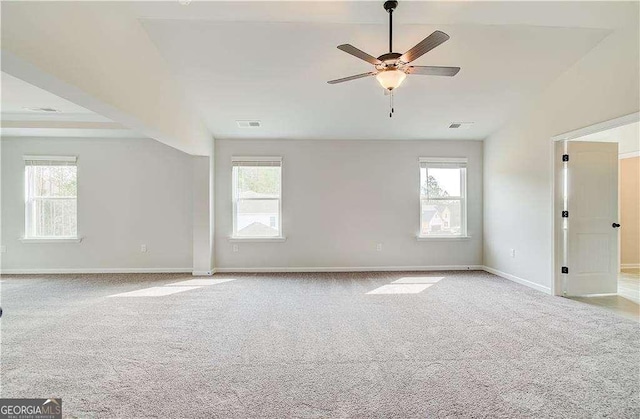 242 Linford Dr, Locust Grove, GA 30248 - carpeted empty room with healthy amount of natural light, ceiling fan, and lofted ceiling