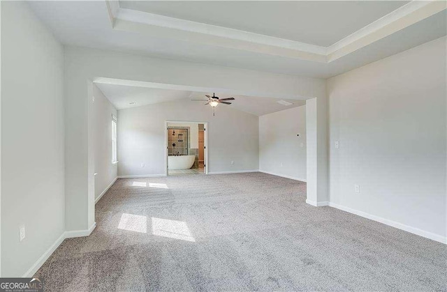 242 Linford Dr, Locust Grove, GA 30248 - empty room featuring carpet flooring, vaulted ceiling, and a ceiling fan