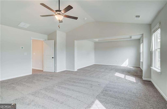 242 Linford Dr, Locust Grove, GA 30248 - unfurnished bedroom featuring carpet floors, vaulted ceiling, and a ceiling fan