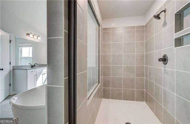 242 Linford Dr, Locust Grove, GA 30248 - bathroom with a tile shower and vanity