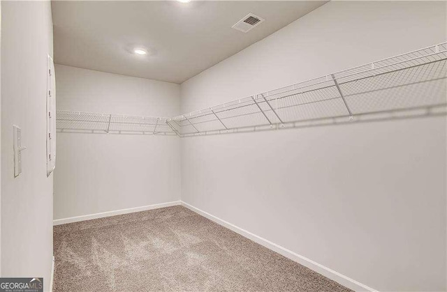 242 Linford Dr, Locust Grove, GA 30248 - spacious closet featuring carpet