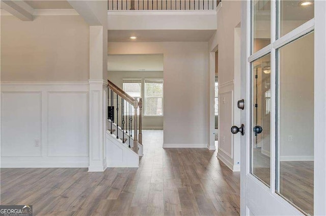 242 Linford Dr, Locust Grove, GA 30248 - foyer with a decorative wall, stairway, wood finished floors, wainscoting, and recessed lighting