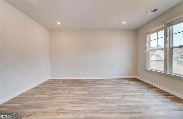 242 Linford Dr, Locust Grove, GA 30248 - unfurnished room featuring light wood-style flooring and recessed lighting