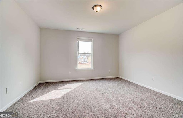 242 Linford Dr, Locust Grove, GA 30248 - carpeted spare room featuring baseboards