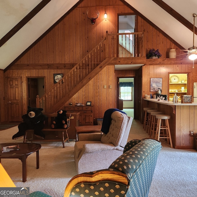 8578 Soapstone Creek Cir, Hiawassee, GA 30546 - living area featuring wooden walls, stairs, high vaulted ceiling, carpet floors, and beamed ceiling