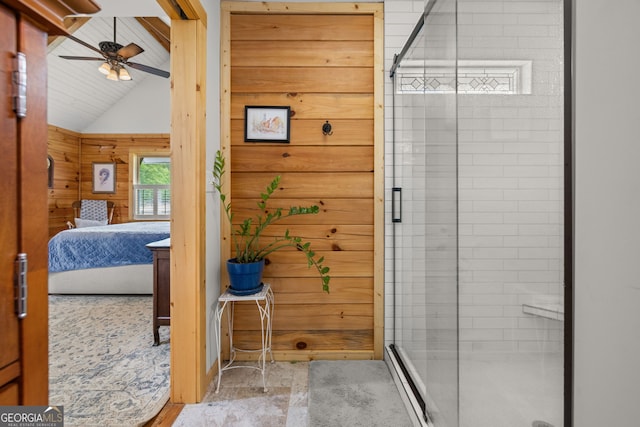 ensuite bathroom featuring vaulted ceiling, wood walls, a shower stall, ceiling fan, and wooden ceiling