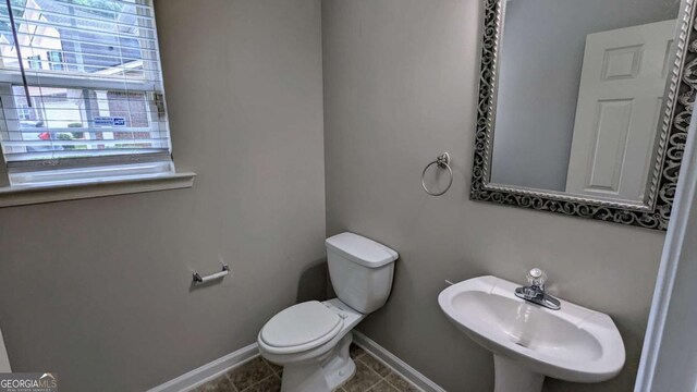 2153 Pine View Trl, Ellenwood, GA 30294 - bathroom with plenty of natural light and tile patterned flooring