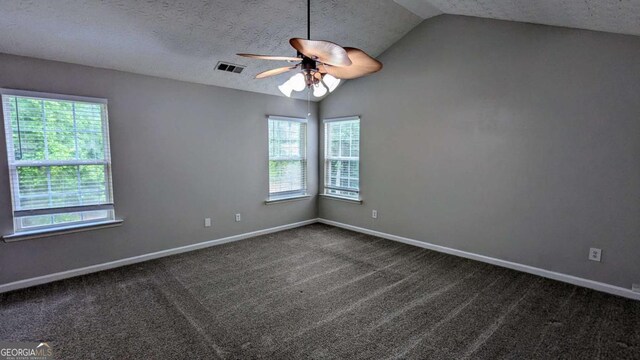 2153 Pine View Trl, Ellenwood, GA 30294 - unfurnished room featuring vaulted ceiling, a ceiling fan, dark colored carpet, and a textured ceiling