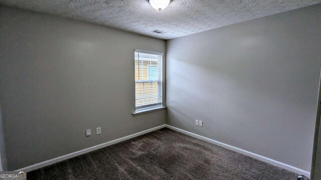 2153 Pine View Trl, Ellenwood, GA 30294 - empty room with dark colored carpet and baseboards