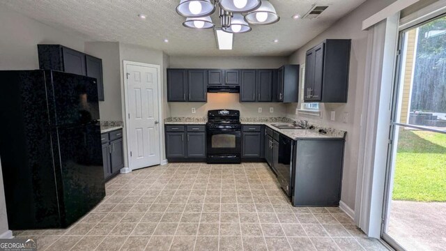 2153 Pine View Trl, Ellenwood, GA 30294 - kitchen featuring black appliances, a chandelier, light countertops, gray cabinetry, and a textured ceiling