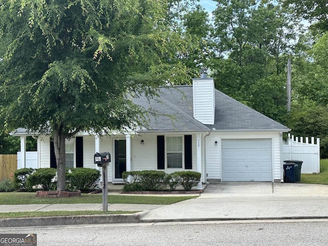 112 Poplar Pointe Ct, Griffin, GA 30224 - view of front facade featuring a garage, concrete driveway, a porch, and a chimney
