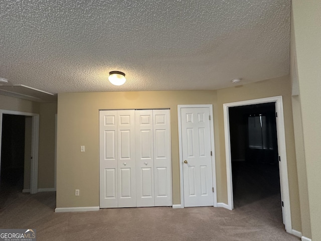 112 Poplar Pointe Ct, Griffin, GA 30224 - unfurnished bedroom featuring carpet floors and a textured ceiling