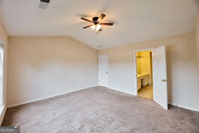 3601 Gainesway Trce, Duluth, GA 30096 - unfurnished bedroom with light carpet, vaulted ceiling, baseboards, ensuite bath, and a ceiling fan