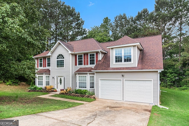 4615 Thermal Ct, Douglasville, GA 30135 - colonial house featuring driveway, a front lawn, and roof with shingles