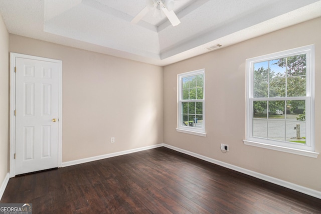 4615 Thermal Ct, Douglasville, GA 30135 - empty room featuring a raised ceiling, dark wood-style floors, ceiling fan, and baseboards