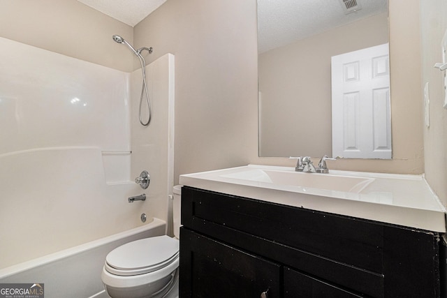 4615 Thermal Ct, Douglasville, GA 30135 - bathroom with toilet, vanity, a textured ceiling, and bathtub / shower combination