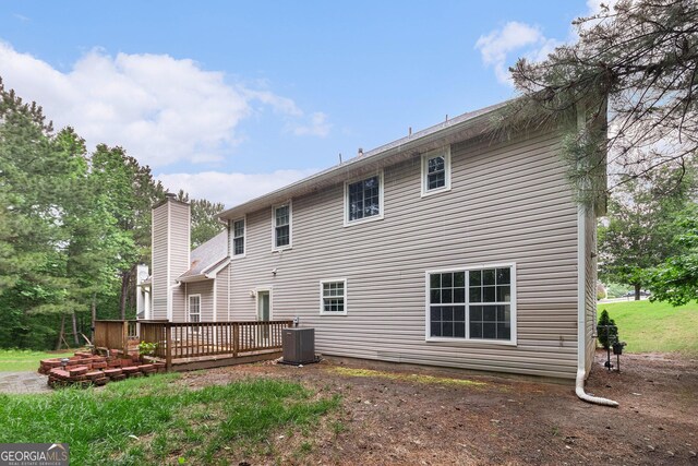 4615 Thermal Ct, Douglasville, GA 30135 - rear view of house featuring a deck, central air condition unit, and a chimney