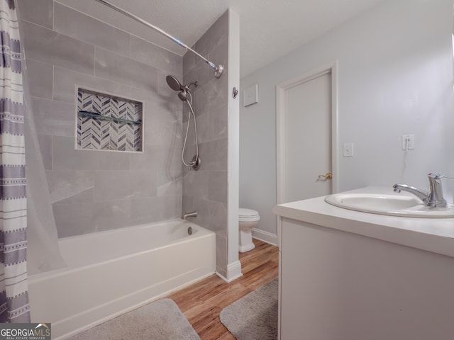 2610 Cumberland Ct, Smyrna, GA 30080 - bathroom with wood finished floors, toilet, shower / tub combo with curtain, and vanity