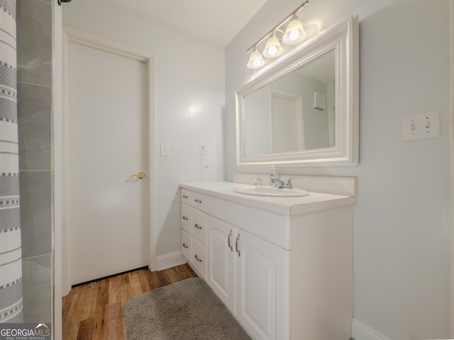 2610 Cumberland Ct, Smyrna, GA 30080 - full bathroom featuring wood finished floors, vanity, and baseboards
