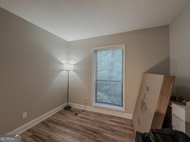 2610 Cumberland Ct, Smyrna, GA 30080 - bonus room with plenty of natural light, wood finished floors, baseboards, and a textured ceiling