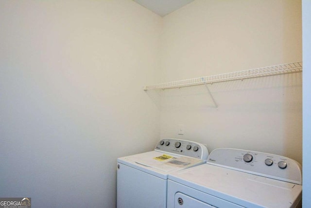 laundry room featuring washer and clothes dryer