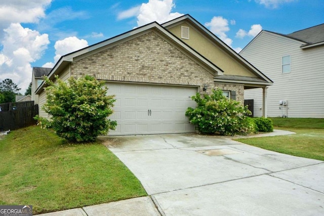 view of front of home featuring a garage, driveway, a front yard, brick siding, and stone siding