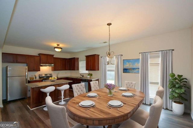 dining room with dark wood-type flooring