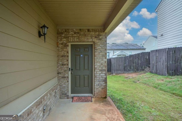 entrance to property featuring stone siding