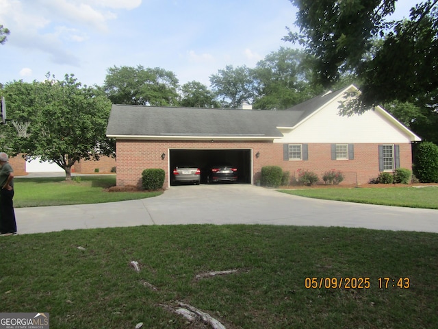 1009 Hunters Pointe Dr, Statesboro, GA 30461 - view of front of property featuring brick siding, concrete driveway, a front yard, and an attached garage